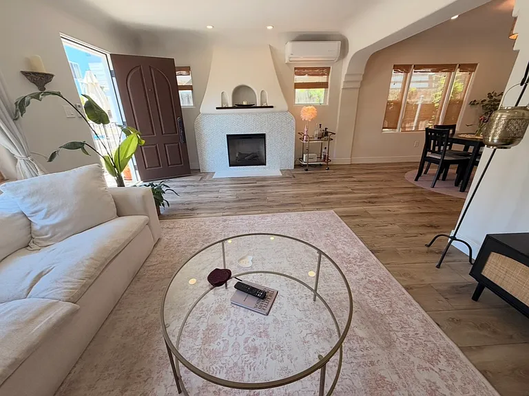 Open living room with fireplace.