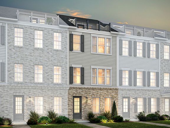 Broxton Exterior 73 features James Hardie TM siding, brick, terrace and 2 car rear load garage