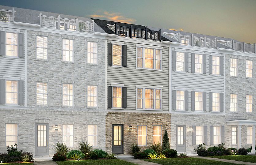 Broxton Exterior 73 features James Hardie TM siding, brick, terrace and 2 car rear load garage