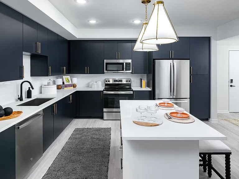 Spacious, modern kitchens feature sleek stainless steel appliances