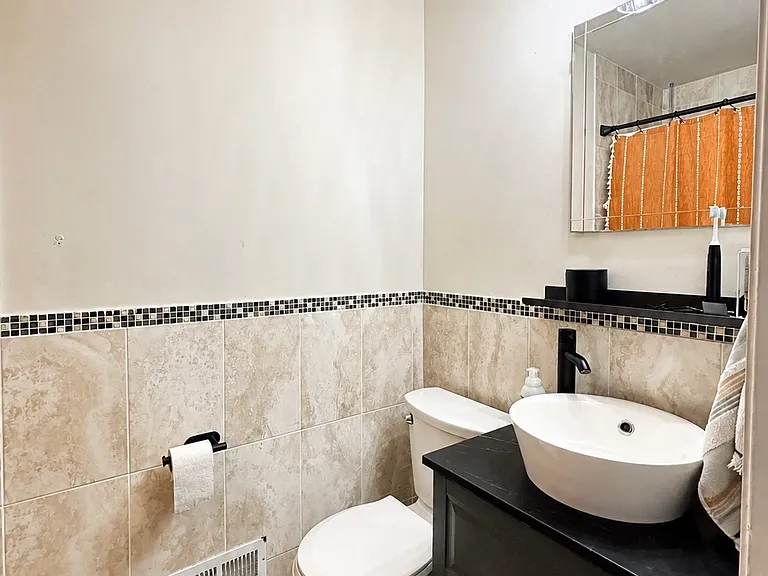 Ensuite Bathroom with new toilet and new fixtures.