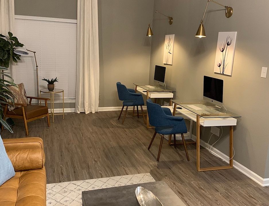 Interior Living Room with Desktops View - Trailwood Village Apartments in Kingwood, TX.
