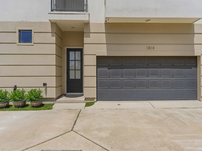 Modern three-story townhome featuring a crisp white exterior and a bright, spacious layout designed for comfortable contemporary living.