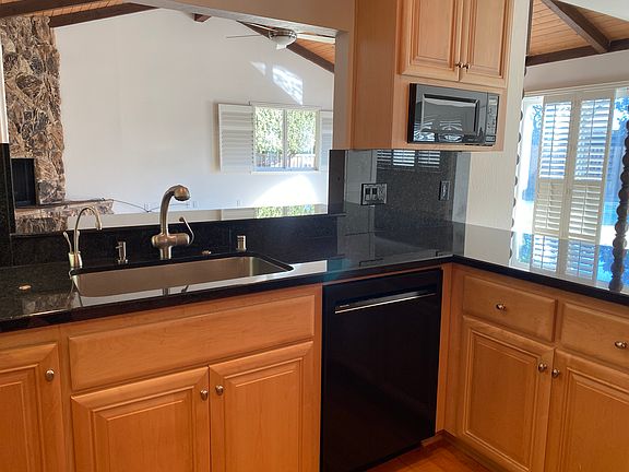 pass-through to the family room, dishwasher & microwave