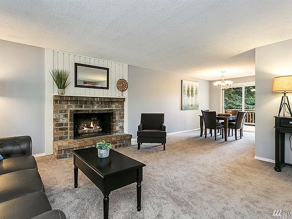 NEW FLOORING & PAINT, ENJOY THE GAS FIREPLACE WHILE RELAXING IN YOUR SPACIOUS LIVING ROOM