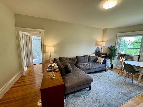 Living room with bedrooms and bathroom down the hall
