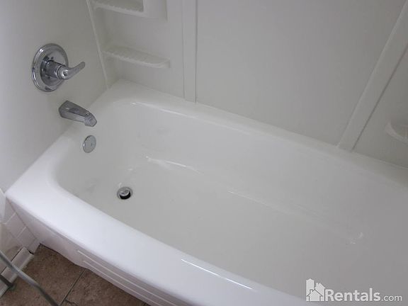 Bath tub-shower surround