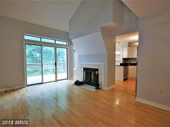 Two story family room with sliders to deck