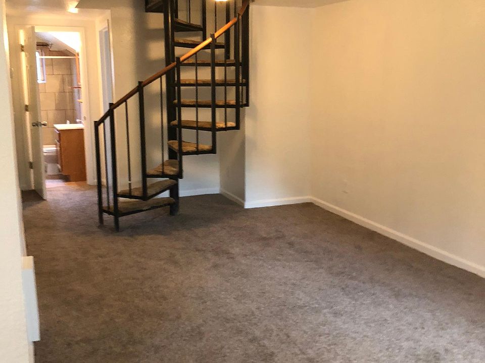 Living room has a stairway for displaying what's important to you There is no access to upstairs apartment.