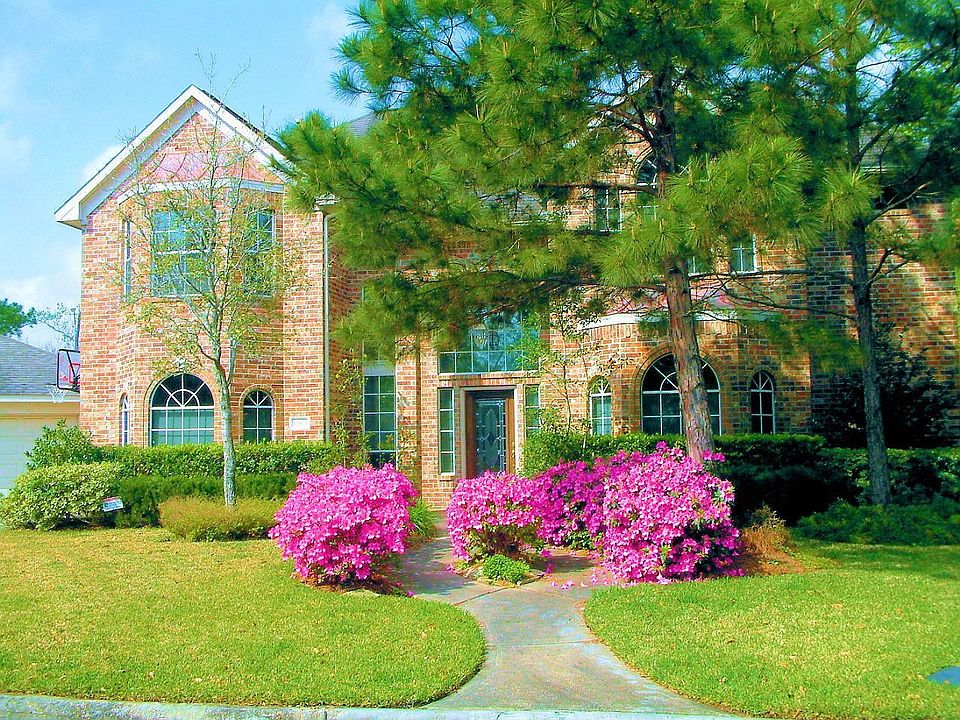 Nestled among mature trees in a c-d-s lot, you'll find this fabulous 5-bedroom