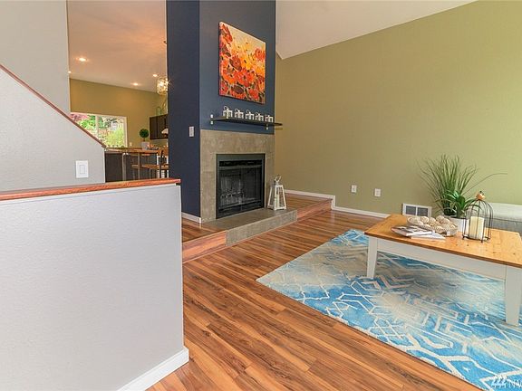 Wonderful dramatic entry and stunning 20ft fireplace with cement hearth and new floors.