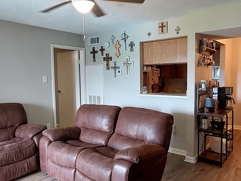 Living room with view of breakfast nook