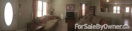 The living room
						:
						A spacious living room greets visitors when they enter from the front door.