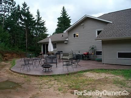 Exterior : Patio starts @ Kitchen patio door and extends all the way to the garage.