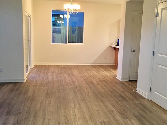 Well lighted dining area with easy to clean waterproof laminate flooring.