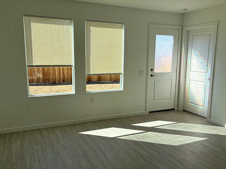 Door leading to backyard. right Door leads to Master bed and bath.
