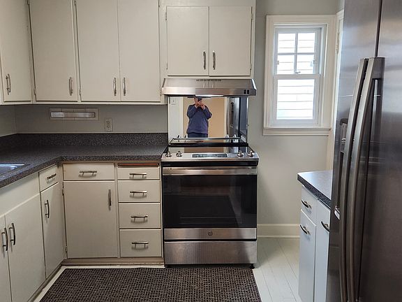 Kitchen/all new stainless appliances/new countertops / electric smooth-top,self-cleaning range / garbage disposal / pull-out trash drawer and recycle bins / fridge with ice and water in door / good light and windows.