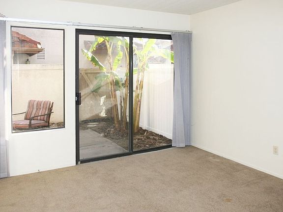 downstairs bedroom with patio