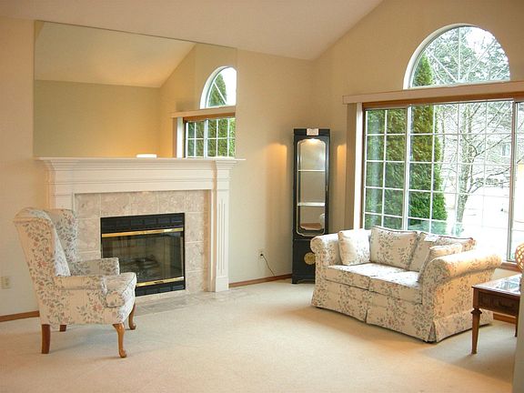 Formal living room with vaulted ceilings and fresh paint