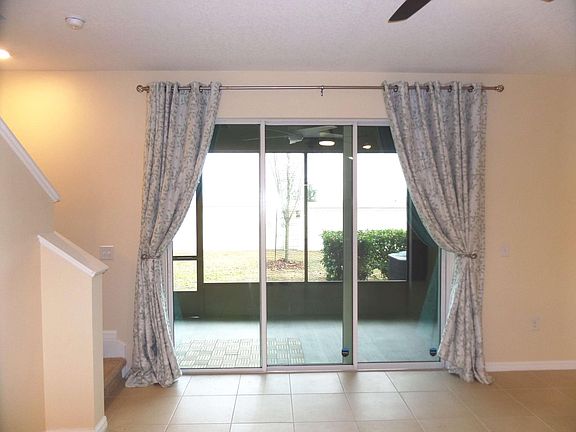 9-foot sliding glass door to 240-sf covered and screened lanai