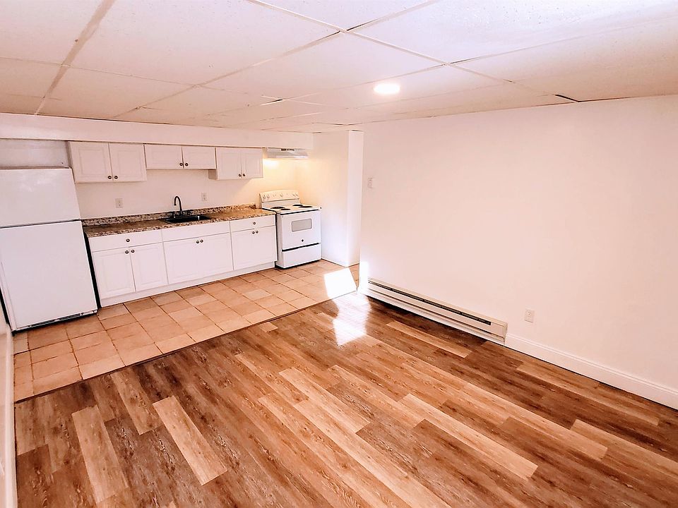 living room and kitchen from apartment entrance