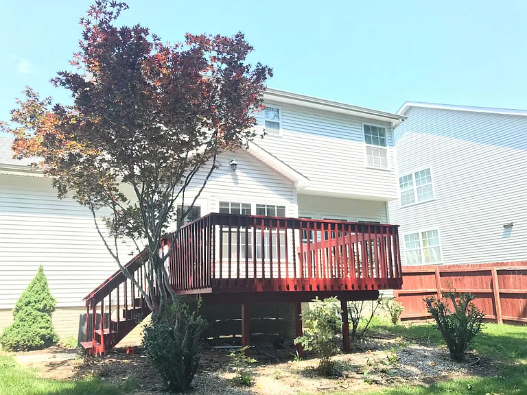 Deck in fenced backyard