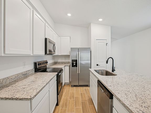 Each kitchen includes stainless steel appliances