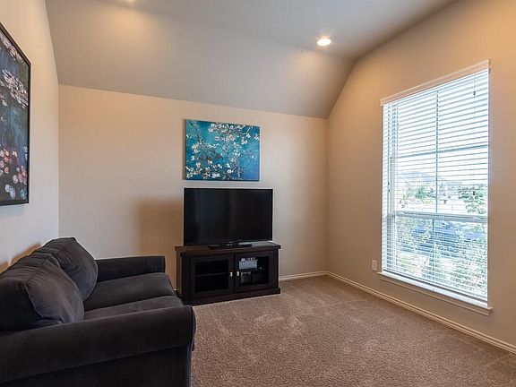 The separate study at the front of the home has double French doors and high ceilings.