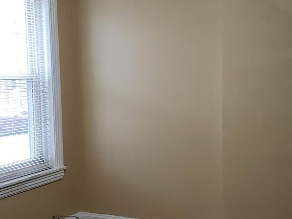 Living room with w/w carpet and ceiling fan