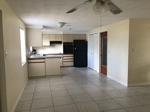 Tiled breakfast area adjacent to kitchen