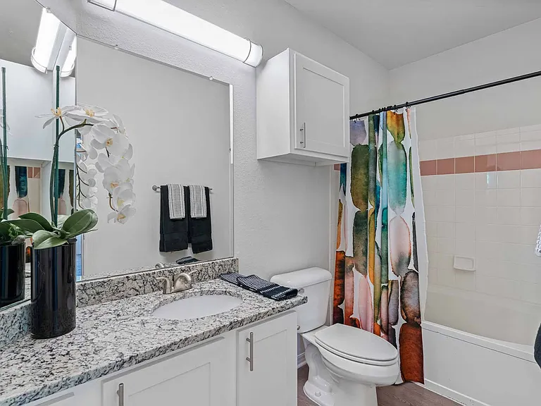 Garden soaking tubs and plentiful storage in bathrooms.