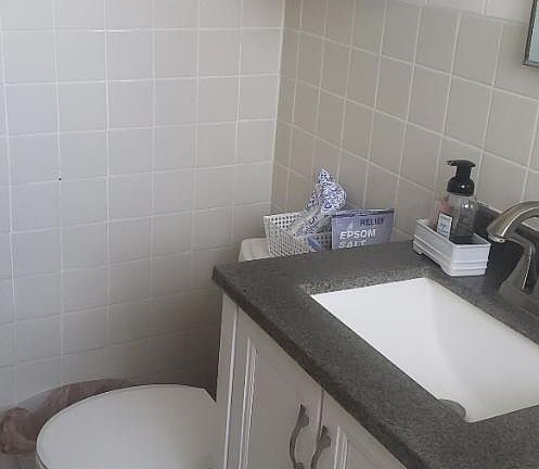 Bathroom with updated vanity and lighting