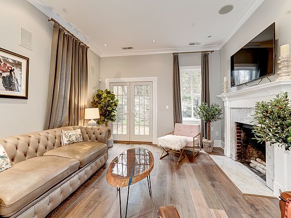 Wood-burning fireplace and TV with remote are included.