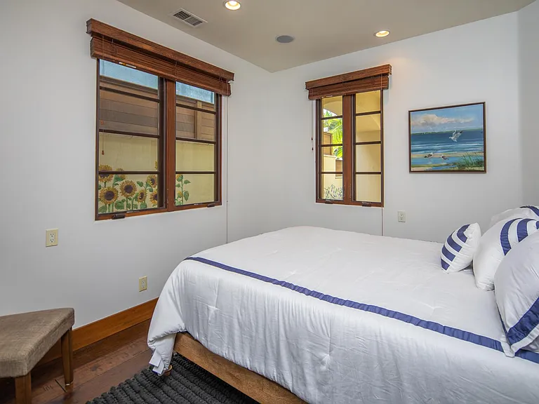 Entry level bedroom with queen bed (full bath in hall)