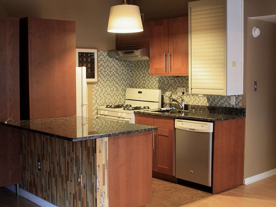 Updated litchen with marble counter tops/breakfast bar