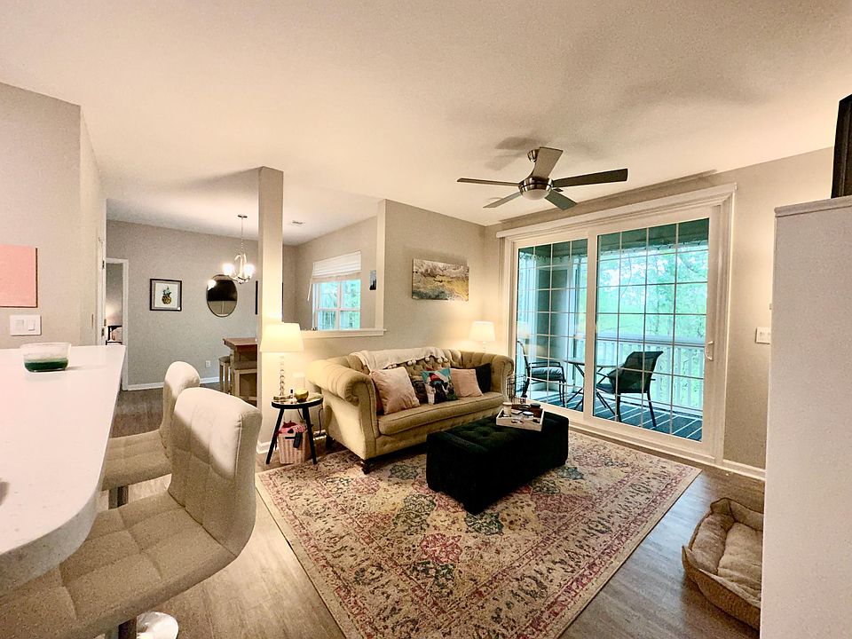 Main living area adjacent to kitchen and dining/flex space.
