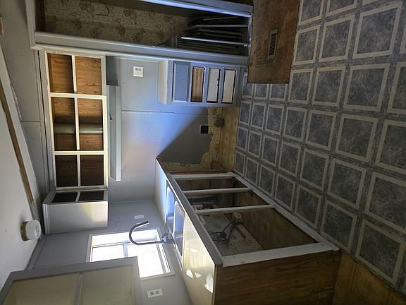 Kitchen showing removed door