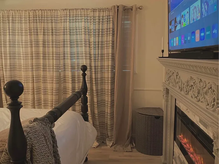 Built in and mantled electric fireplace for forced heat or air with adjustable color settings.