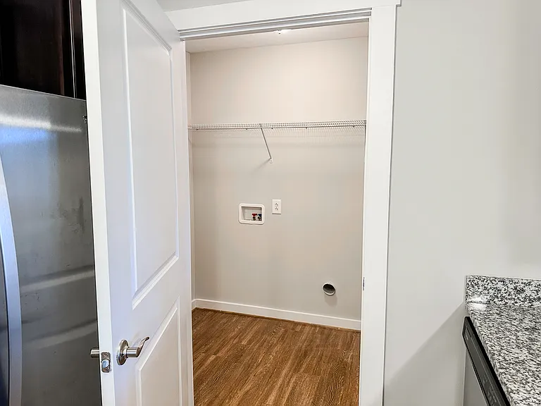 The unit includes a large laundry room with washer and dryer hookups.