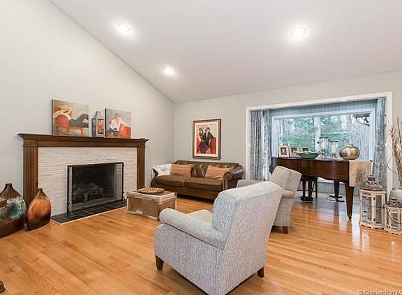 Living/ Family room with cathedral ceiling and fireplace