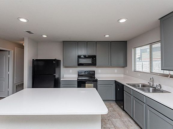 Large island and a lot of storage in this kitchen.