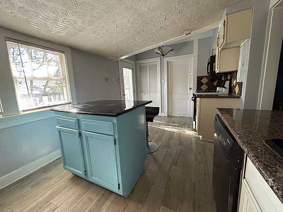 Kitchen view of Breakfast area with Deck Acces, Pantry, and Laundry Room doors