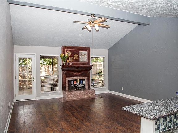 View from the entry. The vaulted ceilings really enhance the open concept of the living room and kitchen. Dining room is immediately to your right.