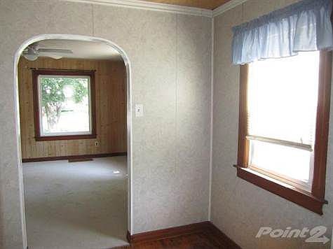 Dining area with hardwood floors.