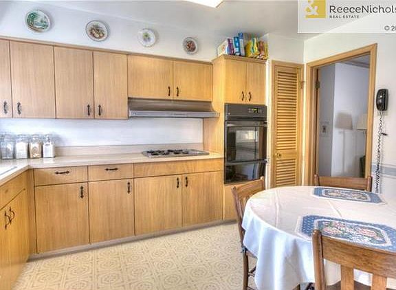Kitchen features an abundance of cabinets and eating space