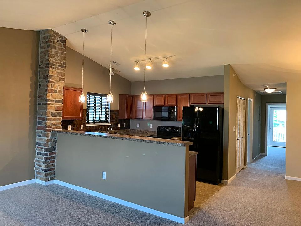 Your unit has an open floor plan with a vaulted ceiling. It also has some great and unique decorative features. The kitchen has a breakfast bar and looks into the family room.