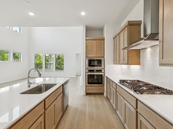 Kitchen in the Da Vinci II home plan by Trophy Signature Homes - REPRESENTATIVE PHOTO
