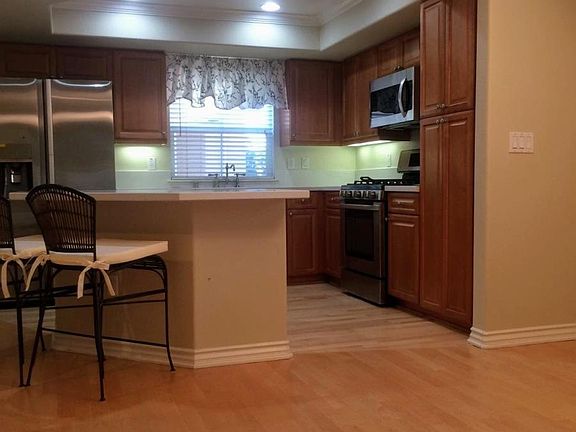 New granite countertops in eat-in kitchen