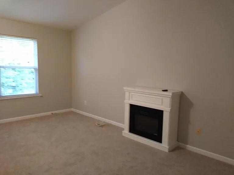 Extra Large Master Bedroom with Fireplace heater, vaulted ceiling, sitting area, and walk-in closet.