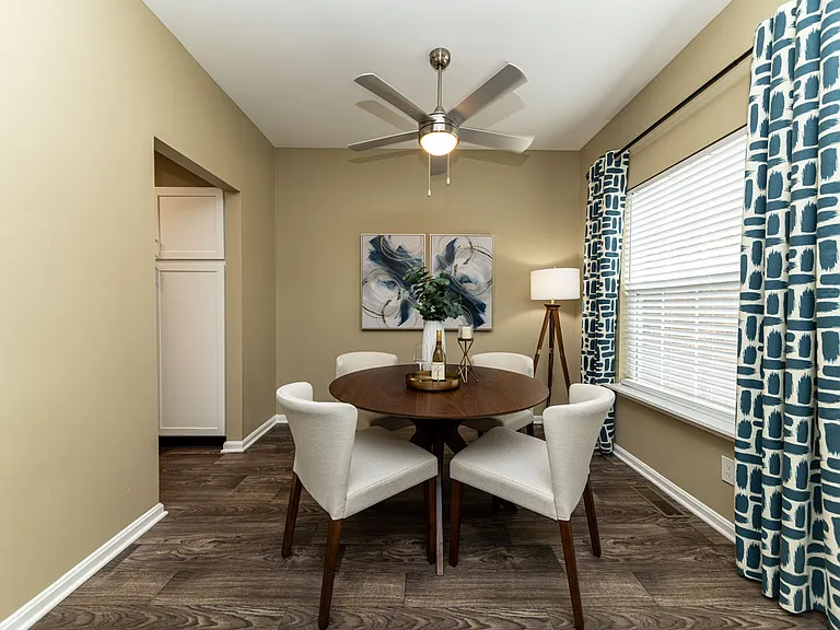 Dining area with hardwood-style flooring